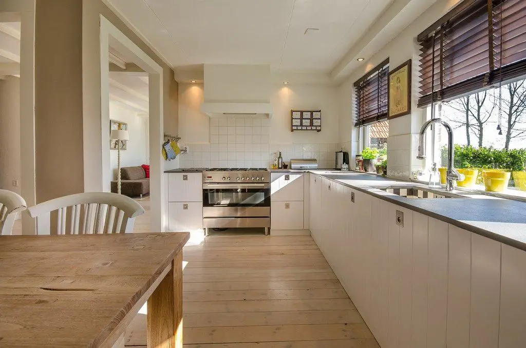a kitchen with shiny wooden floor