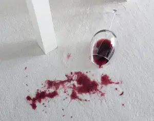 Spilled wine on white carpet