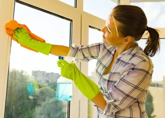 a woman cleaning the windows