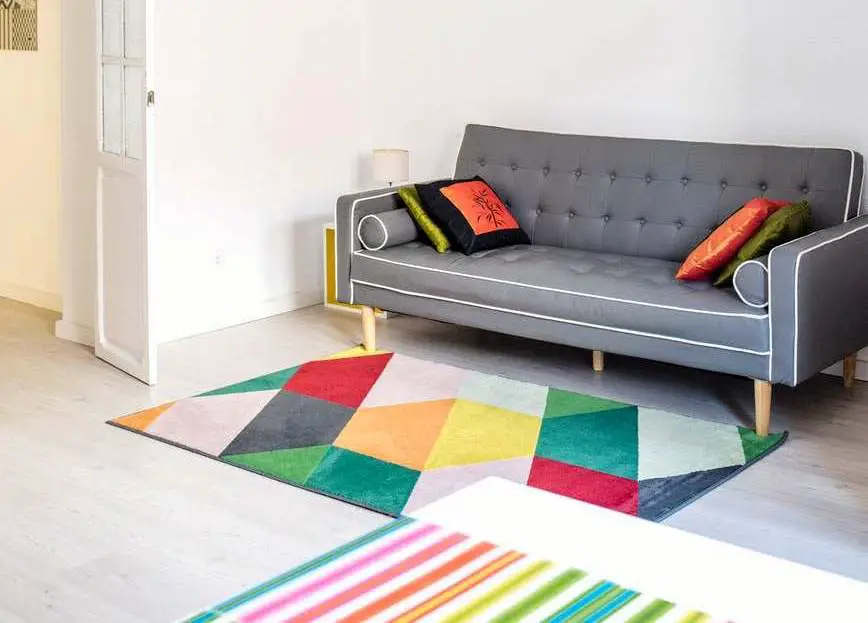 sofa and colorful carpets in the room